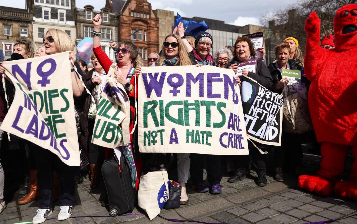 Members of the public take part in a Let Women Speak protest