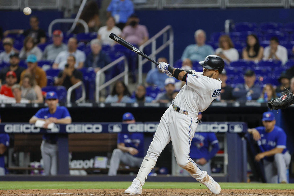 Jun 19, 2023; Miami, Florida, USA; Miami Marlins second baseman Luis Arraez (3) hits a single against the Toronto Blue Jays during the seventh inning at loanDepot Park. Mandatory Credit: Sam Navarro-USA TODAY Sports