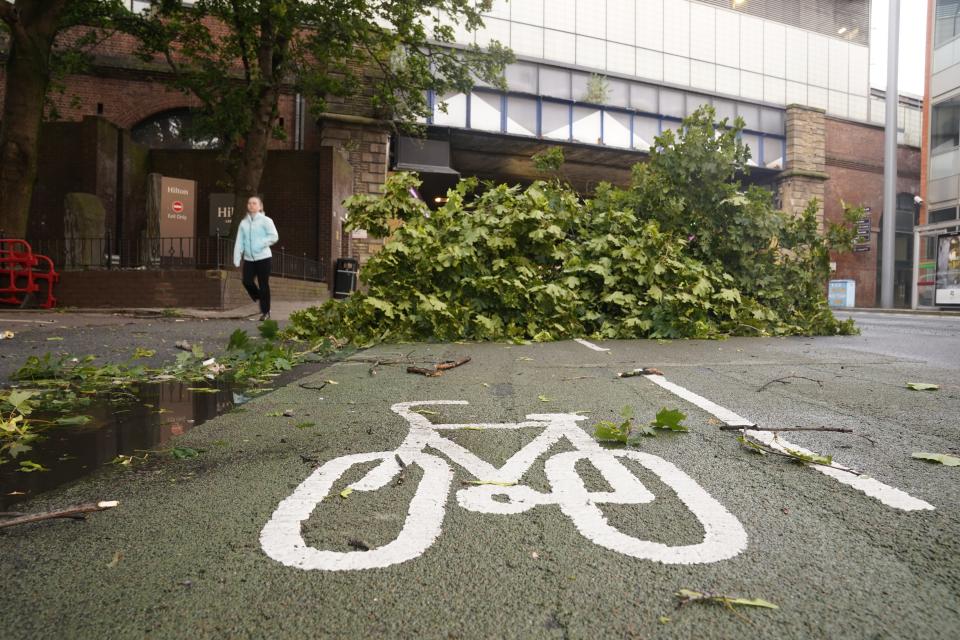 A tree branch blocks a cycle path in Leeds city centre as storm Lilian hits the UK (Danny Lawson/PA Wire)