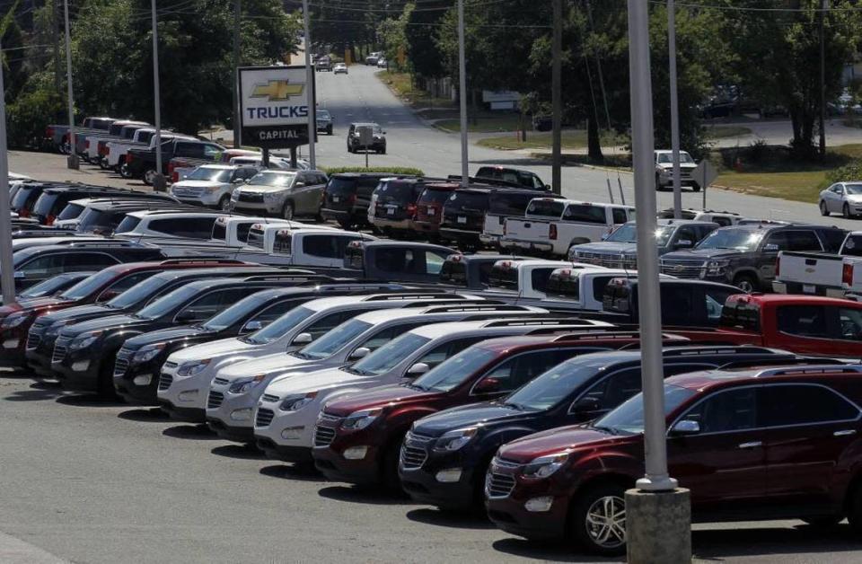 New cars on the lot wait for buyers at the Capital Chevrolet car dealership, formerly Bobby Murray Chevrolet, on August 17, 2016.