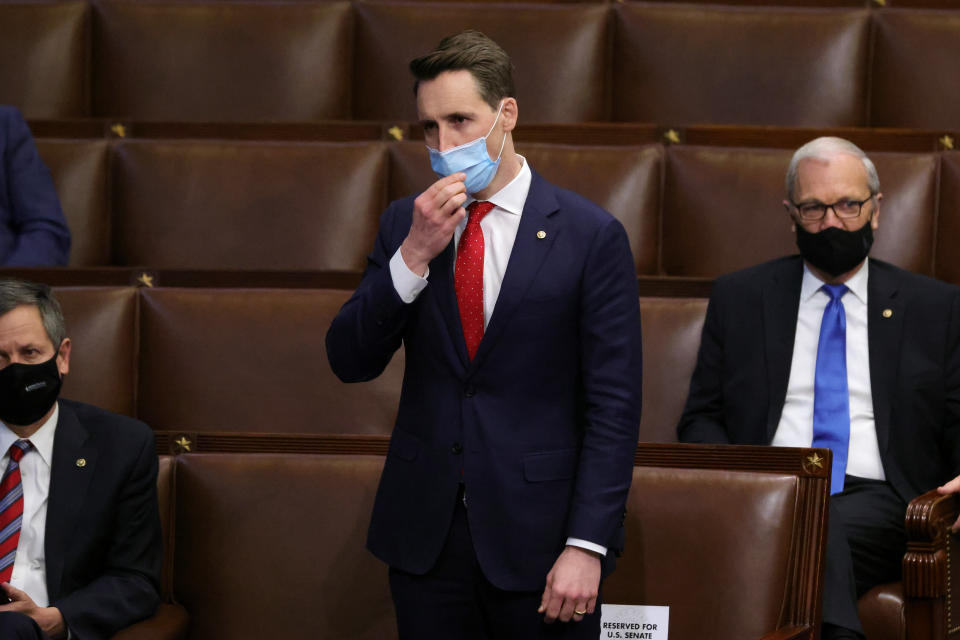 Sen. Josh Hawley (R-Mo.) in the House chamber on Jan. 6. Members returned to chamber after being evacuated when insurrectionists stormed the U.S. Capitol and disrupted a joint session to ratify President-elect Joe Biden's Electoral College win over President Donald Trump. Hawley helped incite the riot.  (Photo: Win McNamee via Getty Images)