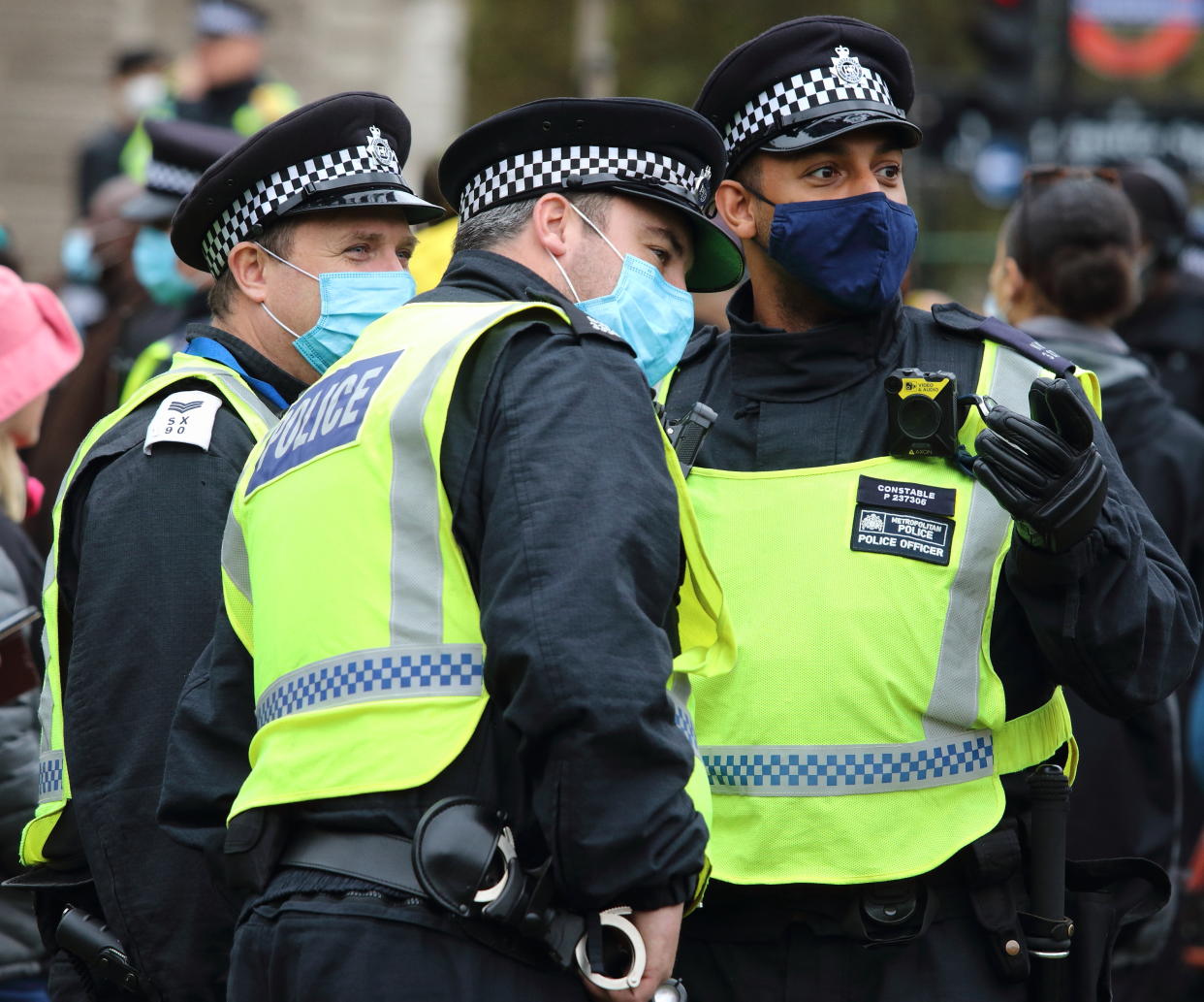  Police officers wearing facemasks are seen having a conversation before the start of the protest. With a number of expected demonstrations taking place in the capital this weekend, the Metropolitan Police mobilized staffing from all quarters. Territorial Support Group (TSG) the Met's Public Order operating unit, Mounted police, motorbikes and other vehicles plus a large number of officers on foot. (Photo by Keith Mayhew / SOPA Images/Sipa USA) 