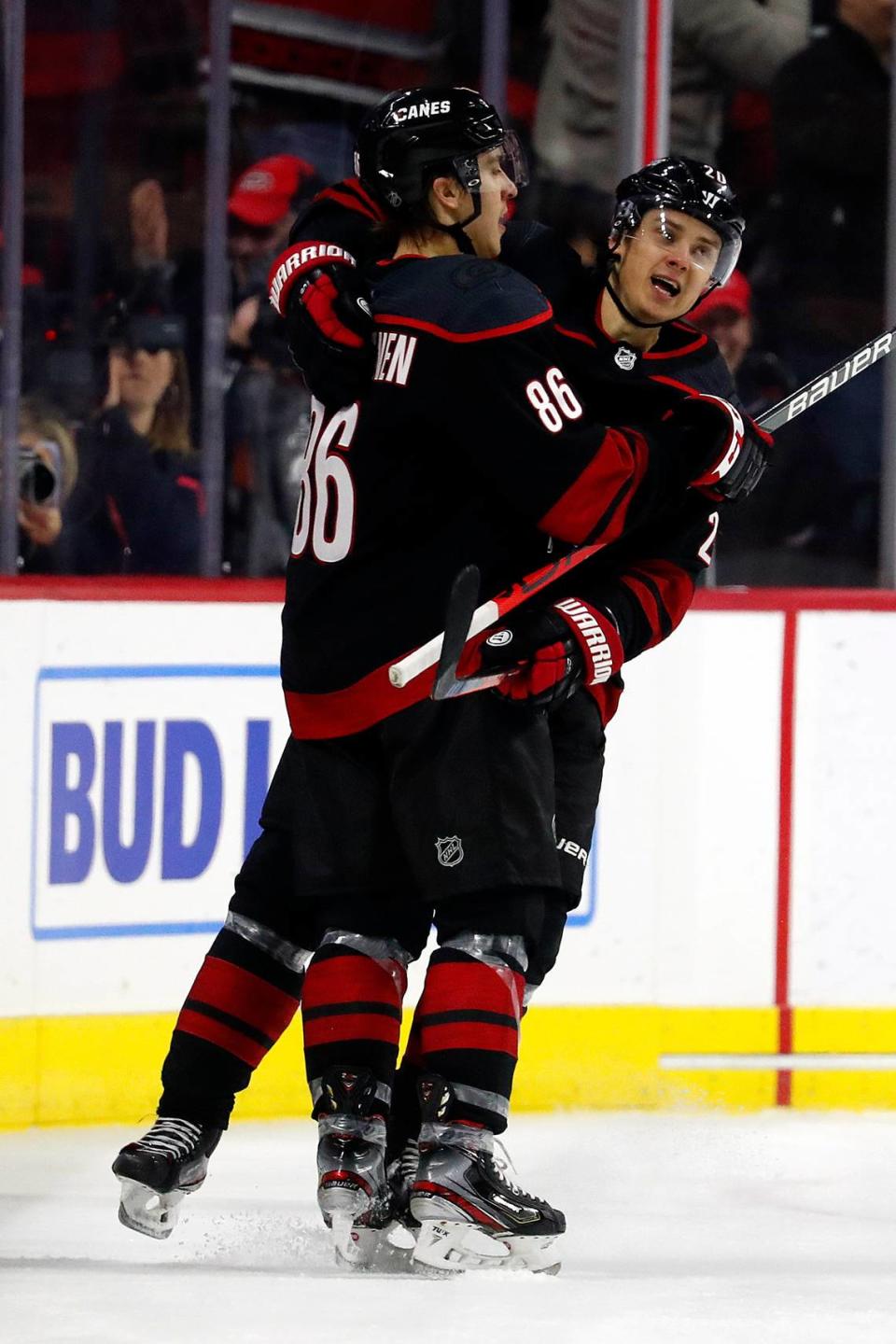 Carolina Hurricanes’ Teuvo Teravainen (86), of Finland, celebrates his goal with teammate Sebastian Aho (20), of Sweden, during the third period of an NHL hockey game against the Colorado Avalanche in Raleigh, N.C., Friday, Feb. 28, 2020. (AP Photo/Karl B DeBlaker)