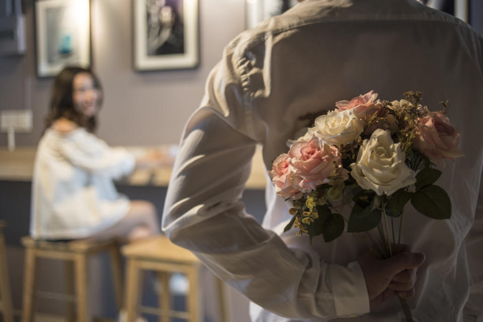 Wedding couple - Man surprise his mate with flower.