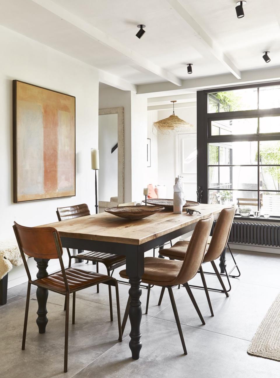 a dining room table with chairs around it