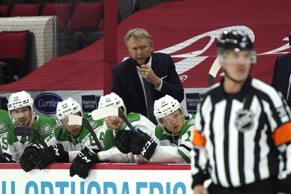 Dallas Stars coach Rick Bowness reacts during the second period of the team's NHL hockey game against the Carolina Hurricanes in Raleigh, N.C., Sunday, April 4, 2021. (AP Photo/Gerry Broome)