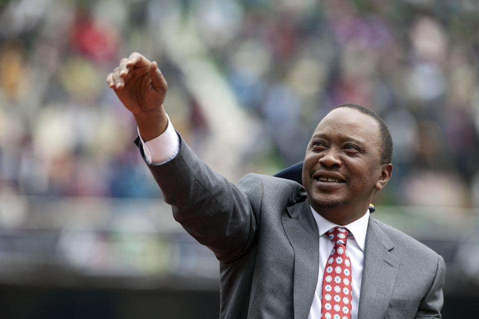 FILE - In this Thursday Dec. 12, 2013 file photo, Kenyan president Uhuru Kenyatta waves to the crowd as Kenya celebrates 50 years of independence in Nairobi, Kenya. Prosecutors at the International Criminal Court have asked judges not to reject their faltering case against Kenyan President Uhuru Kenyatta entirely, despite acknowledging they do not have enough evidence to convict him. Defense lawyers have demanded acquittal. Presiding Judge Kuniko Ozaki said the panel hearing the case in The Hague, Netherlands, will not decide the matter Wednesday Feb. 5, 2014. (AP Photo/Sayyid Azim, File)
