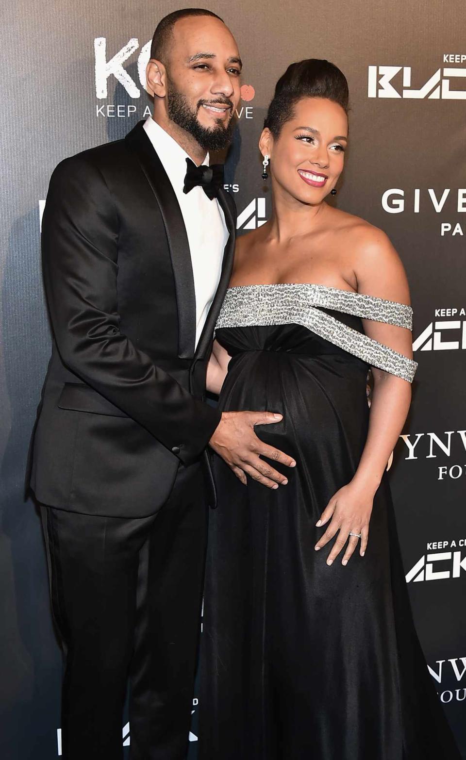 Swizz Beats (L) and Alicia Keys attends the 9th annual Keep A Child Alive Black Ball at Hammerstein Ballroom on October 30, 2014 in New York City