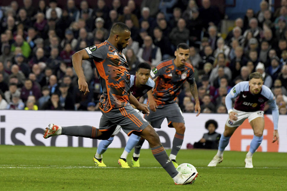 Olympiacos' Ayoub El Kaabi scores his side's third goal from the penalty spot during the Europa Conference League semifinal, first leg, soccer match between Aston Villa and Olympiacos at Villa Park in Birmingham, England, Thursday, May 2, 2024. (AP Photo/Rui Vieira)