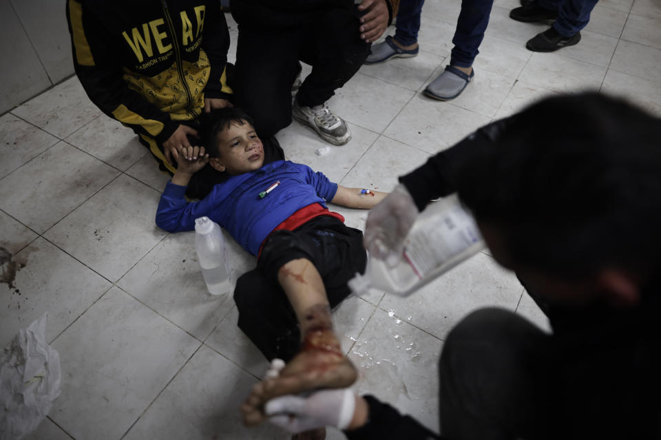 Palestinians wounded in the Israeli bombardment of the Gaza Strip are treated in a hospital in Khan Younis, Monday, Jan. 15, 2024. (AP Photo/Mohammed Dahman)