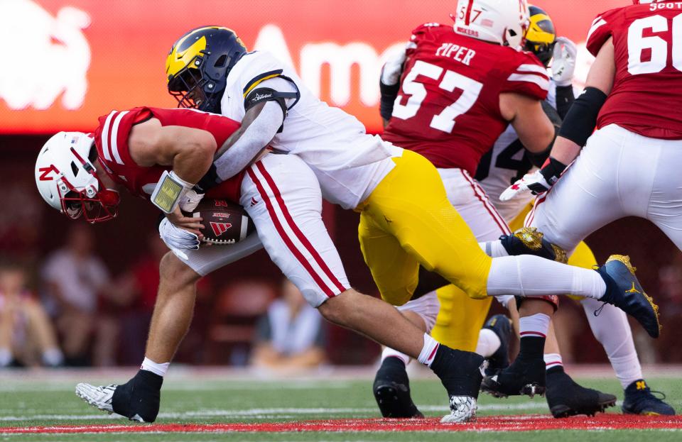 Michigan's Josaiah Stewart, right, sacks Nebraska quarterback Heinrich Haarberg on the 4th down with 10 yards to go during the second half of an NCAA college football game, Saturday, Sept. 30, 2023, in Lincoln, Neb. Michigan defeated Nebraska 45-7.