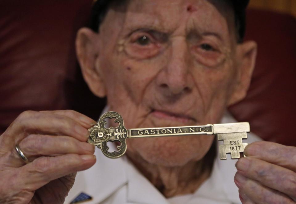 100-year-old Army veteran Ray Stewart holds the Key to the City of Gastonia that he recently received for his birthday.