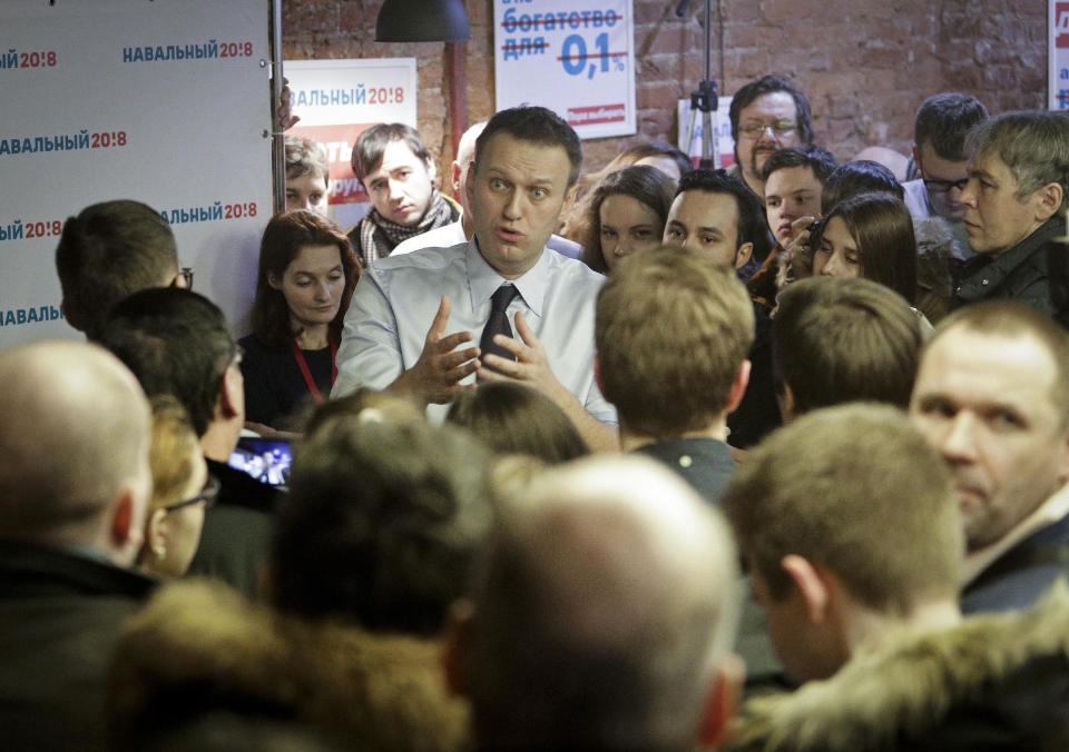Russian opposition leader Alexei Navalny speaks with his supporters at the opening of his campaign office in St. Petersburg, Russia, Saturday, Feb. 4, 2017. Alexei Navalny, Russia's most prominent opposition figure, has opened his first regional office for a presidential bid, despite an imminent court verdict that could bar him from running.(AP Photo/Elena Ignatyeva)
