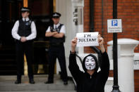 LONDON, ENGLAND - AUGUST 16: Supporters of Julian Assange, the founder of the WikiLeaks website, gather outside the Ecuadorian Embassy on August 16, 2012 in London, England. Mr Assange has been living inside Ecuador's London embassy since June 19, 2012 after requesting political asylum whilst facing extradition to Sweden to face allegations of sexual assault. His request was granted by Ecuador this afternoon. (Photo by Matthew Lloyd/Getty Images)