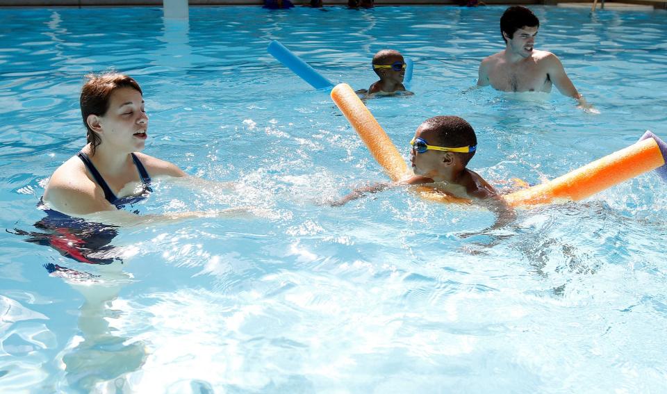 Alice Deters walks backwardsin the pool as X'zayveier Horner, 4, swims towards her as he uses a noodle to stay afloat at Freeman Pool in Tuscaloosa on Tuesday, June 27, 2017.