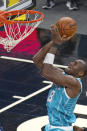 Charlotte Hornets center Bismack Biyombo takes a shot against the Orlando Magic during the second half of an NBA basketball game, Monday, Jan. 25, 2021, in Orlando, Fla. (AP Photo/John Raoux)