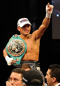 Abner Mares celebrates after winning the IBF bantamweight title on Saturday night