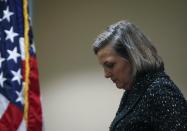 U.S. Assistant Secretary of State Victoria Nuland leaves after a news conference at the U.S. embassy in Kiev February 7, 2014. U.S. Diplomat Nuland, whose telephone conversation about the political crisis in Ukraine was leaked on the Internet, said on Friday that the recording was "pretty impressive tradecraft" but suggested the leak would not harm her ties with the Ukrainian opposition. REUTERS/Gleb Garanich (UKRAINE - Tags: POLITICS CIVIL UNREST)