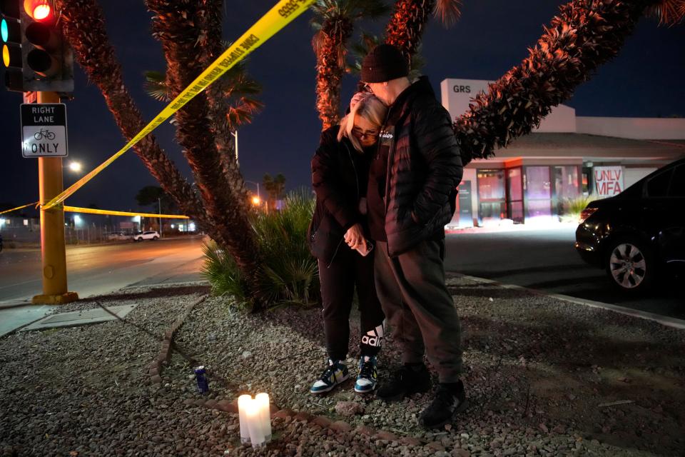 Sean Hathcock, right, kisses Michelle Ashley after the two left candles for victims of a shooting at the University of Nevada (Copyright 2023 The Associated Press. All rights reserved.)