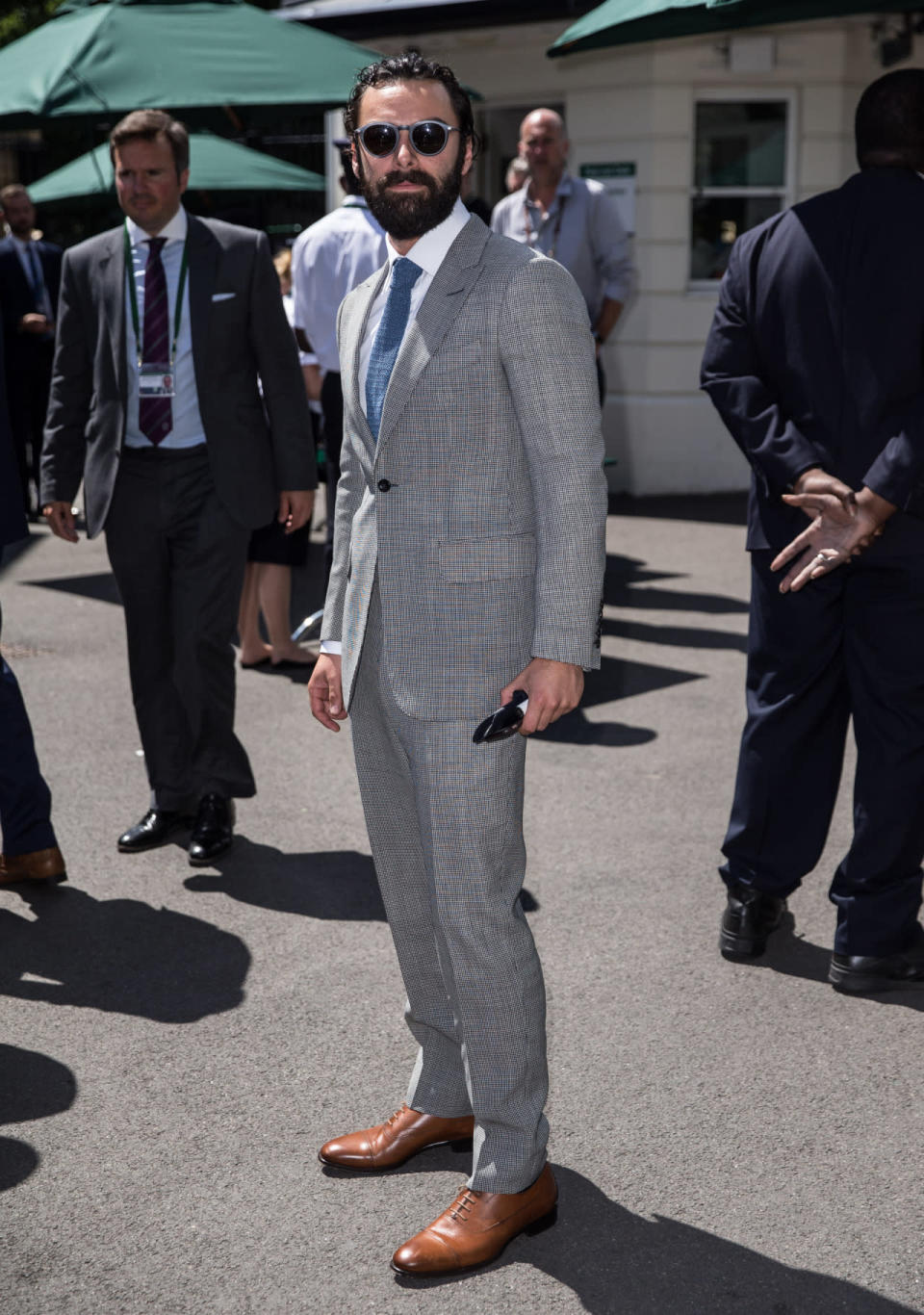 <p>The ‘Poldark’ star scrubbed up wonderfully for his appearance at the tennis courts. <i>[Photo: Rex]</i></p>