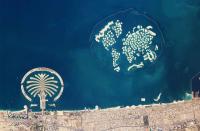 A clear shot of the artificial archipelagos of Dubai's Palm Jumeirah (left) and The World (right) taken from the International Space Station.