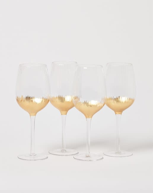 Oliver Bonas gold wine glasses