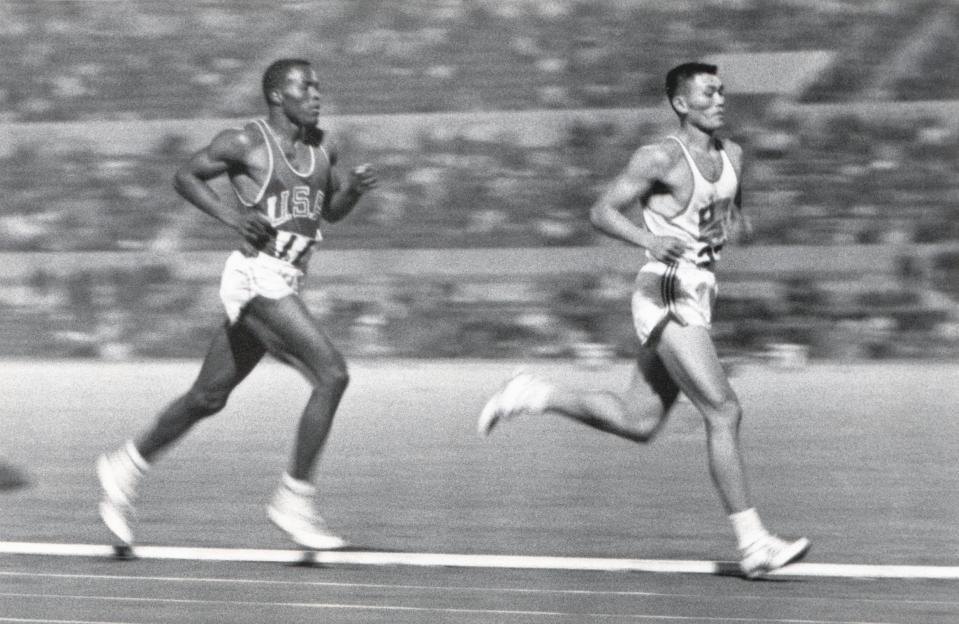 ROME - 1960: Rafer Johnson of the United States competes against Yang Chuan-kwang of China in the 1500 Metres portion of the Decathlon competition during the 1960 Summer Olympics in Rome, Italy. (Photo by Robert Riger/Getty Images) 