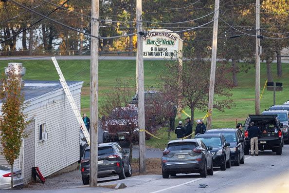 LEWISTON, MAINE - OCTOBER 26: Law enforcement officials investigate outside the Schemengees Bar and Grille on October 26, 2023 in Lewiston, Maine. Police are still searching for the suspect in the mass shooting, Robert Card, who killed over 15 people in two separate shootings. (Photo by Scott Eisen/Getty Images)