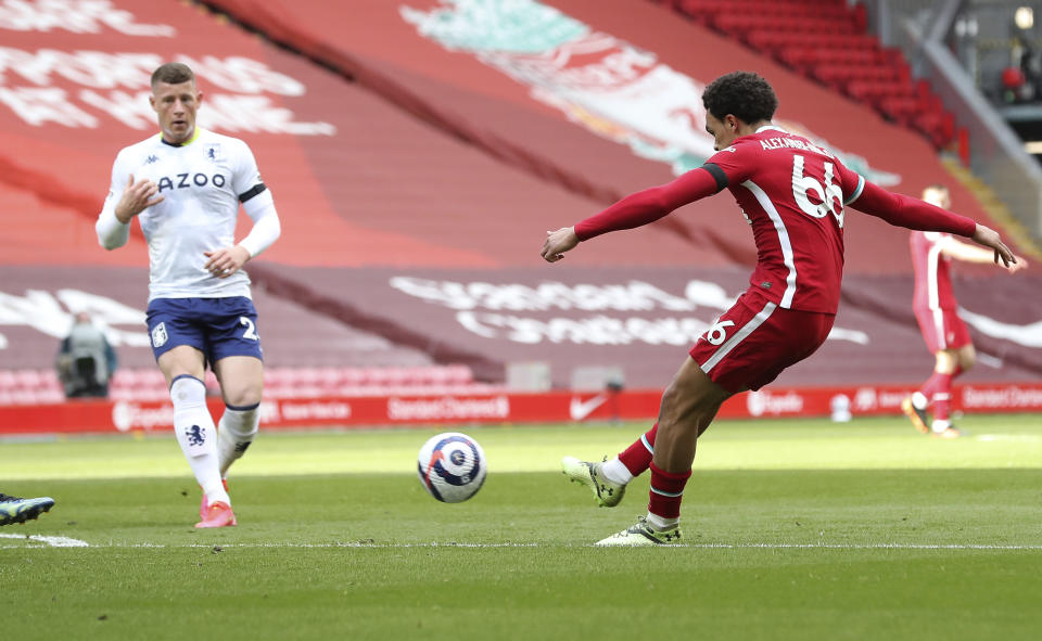 Liverpool's Trent Alexander-Arnold scores his side's second goal during the English Premier League soccer match between Liverpool and Aston Villa at Anfield stadium in Liverpool, England, Saturday, April 10, 2021. (Martin Rickett/Pool via AP)