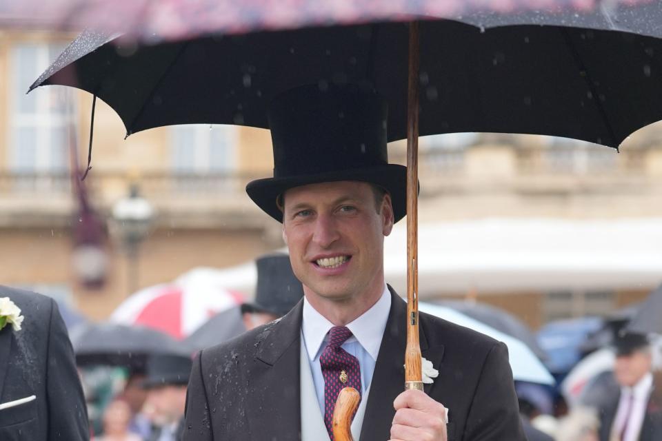 The Prince of Wales uses an umbrella during the Sovereign’s Garden Party (Yui Mok/PA) (PA Wire)
