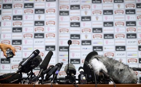 Microphones are seen on a table before the start of a news conference in Sochi, Russia, July 2, 2018. REUTERS/Hannah McKay