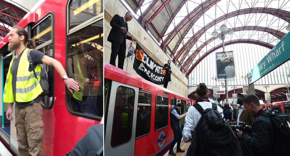 Protesters attach themselves to a DLR train in Canary Wharf on Wednesday morning. (PA)