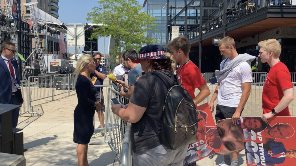 U.S. Rep. Marjorie Taylor Greene speaks to a reporter outside Fiserv Forum Wednesday afternoon. A handful of supporters of former president Donald Trump were walking around the area holding signs throughout the day. Some stopped to hear Taylor Greene speak.