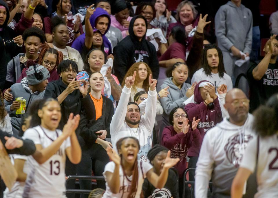 Peoria High fans in the student section cheer for the Lions as they take the lead against Nazareth Academy in the first half of the Class 3A state semifinals Friday, March 3, 2023 at CEFCU Arena in Normal. The Lions ultimately fell to the Roadrunners 48-35.