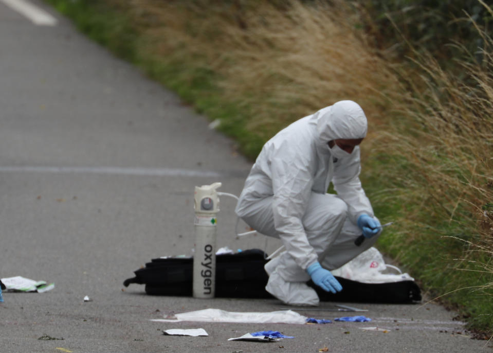 A police investigator at the scene of an incident, near Sulhamstead, Berkshire, where a Thames Valley Police officer was killed whilst attending a reported burglary on Thursday evening.