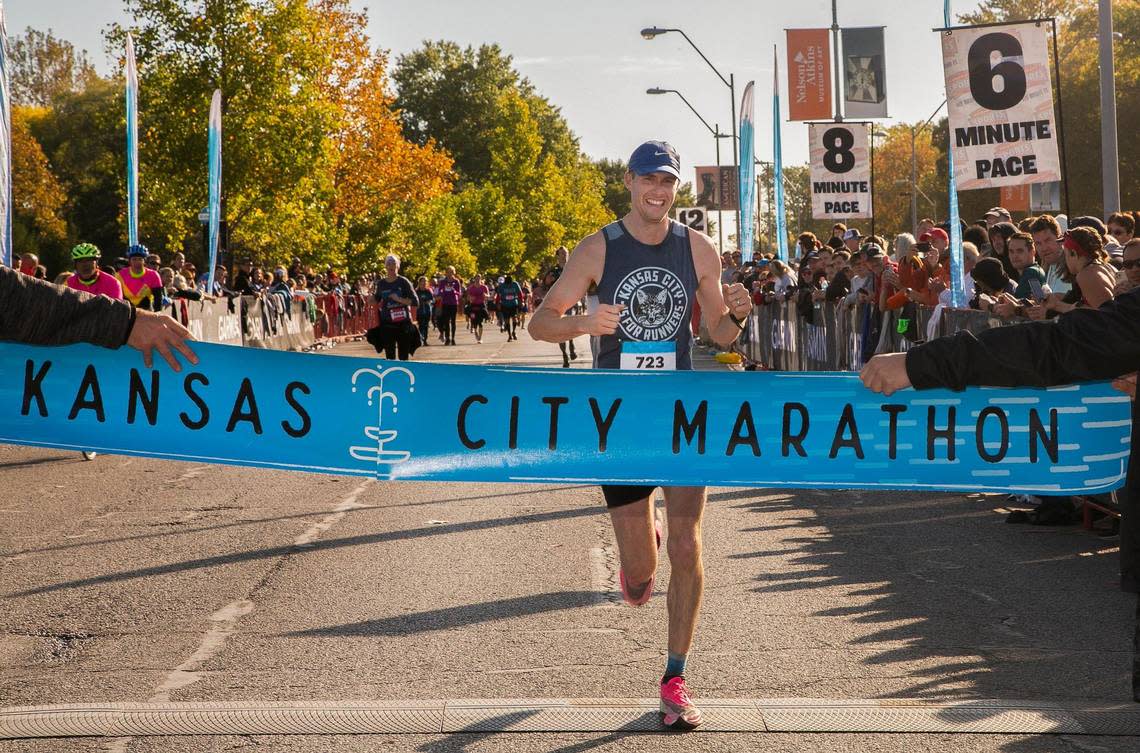 Kyle Baldwin of Kansas City, the men’s winner of the Garmin Kansas City Marathon, crosses the finish line Saturday, October 15, 2022.