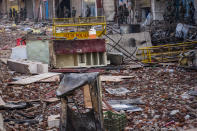 Indian policemen stand guard next to the debris in a riot-affected area on February 26, 2020 in Delhi, India. At least 27 people have been killed, hundreds injured and property worth millions damaged in communal violence that erupted in Indias national capital this week over the controversial Citizenship Amendment Act as US President Donald Trump arrived in the country on his maiden visit. The Delhi High Court on Wednesday pulled up the local police for its failure to control the violence and directed it to file First Information Reports against four leaders of the ruling Bharatiya Janata Party for making hate speeches that allegedly led to the violence. (Photo by Yawar Nazir/ Getty Images)