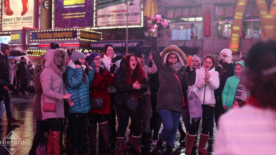 The couple’s bouqet toss involved dozens of eager strangers. (Photo: Lorenzo Media Productions)