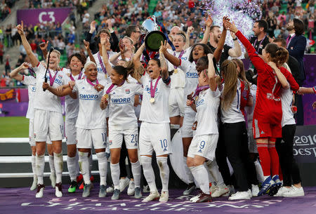 Soccer Football - Women's Champions League Final - Ferencvaros Stadium, Budapest, Hungary - May 18, 2019 Olympique Lyonnais' Dzsenifer Marozsan and team mates celebrate winning the Women's Champions League final with the trophy REUTERS/Bernadett Szabo