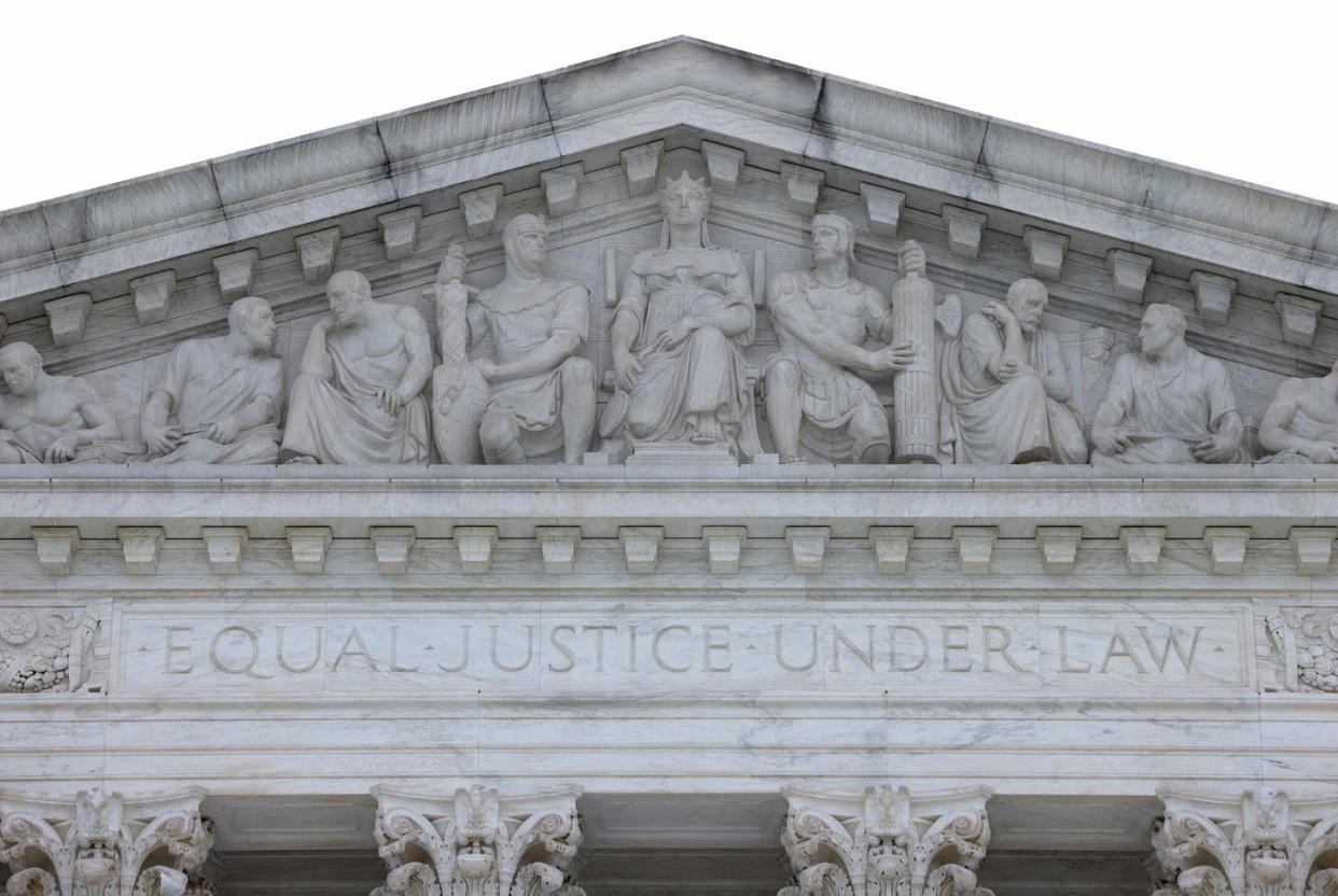 <span class="caption">The Supreme Court has no army to enforce its decisions; its authority rests solely on its legitimacy.</span> <span class="attribution"><a class="link " href="https://www.gettyimages.com/detail/news-photo/the-u-s-supreme-court-is-shown-june-21-2021-in-washington-news-photo/1324719634?adppopup=true" rel="nofollow noopener" target="_blank" data-ylk="slk:Win McNamee/Getty Images;elm:context_link;itc:0;sec:content-canvas">Win McNamee/Getty Images</a></span>