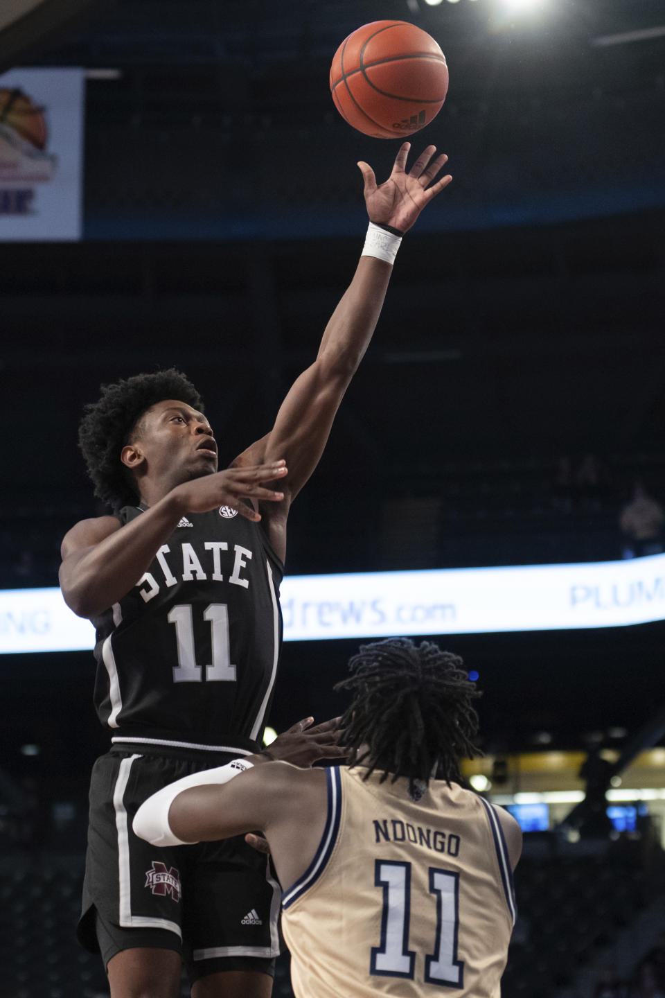 Mississippi State guard Trey Fort (11) shoots against Georgia Tech forward Baye Ndongo (11) in the first half of an NCAA college basketball game Tuesday, Nov. 28, 2023, in Atlanta. (AP Photo/Hakim Wright Sr.)