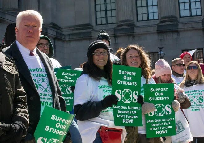 Former Brick Mayor John Ducey stands in Trenton with protestors in March 2019 to oppose school funding cuts.