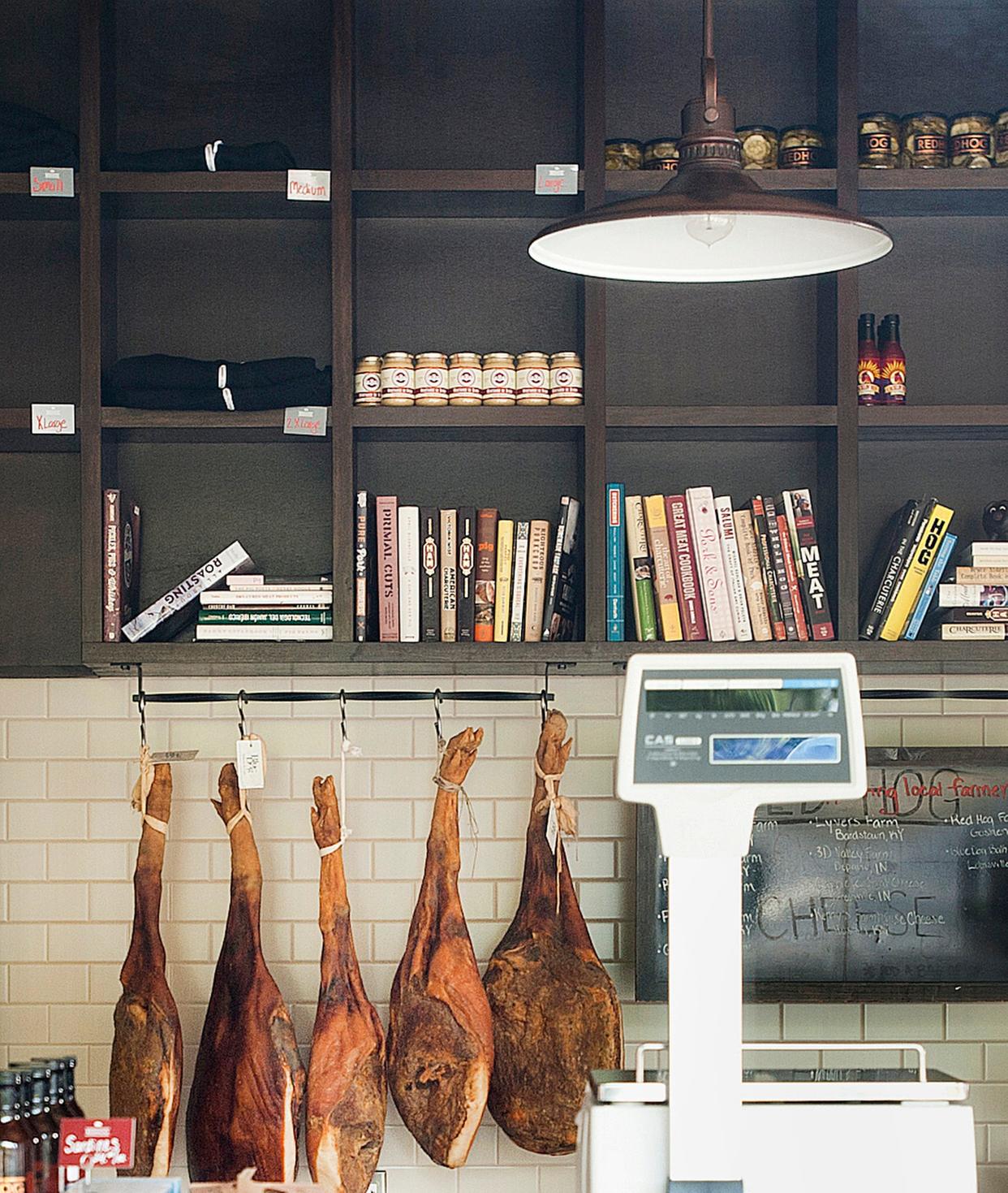 Cured meats hanging in The Red Hog Restaurant and Butcher Shop on Frankfort Ave. in Crescent Hill.07 October 2019