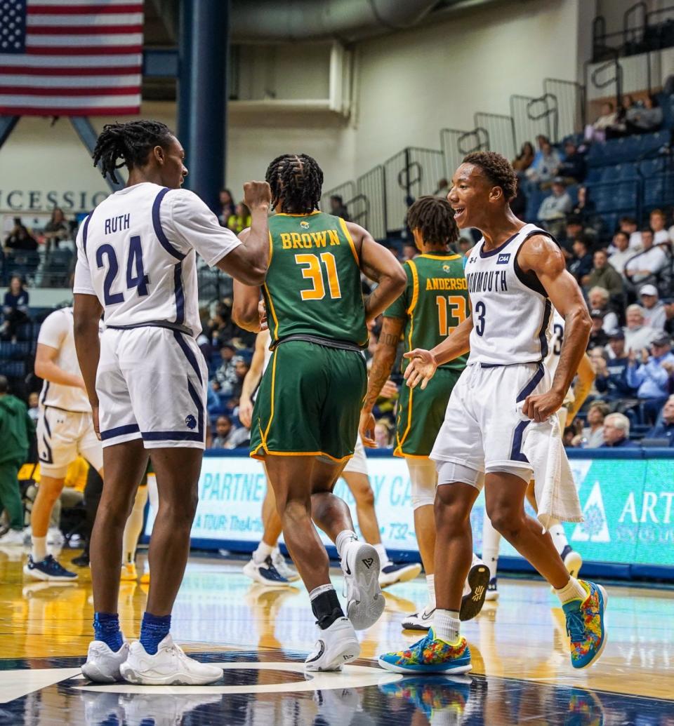 Monmouth's Jakari Spence (3) and Myles Ruth (24) celebrate against Norfolk State on Nov. 17, 2022 in West Long Branch.