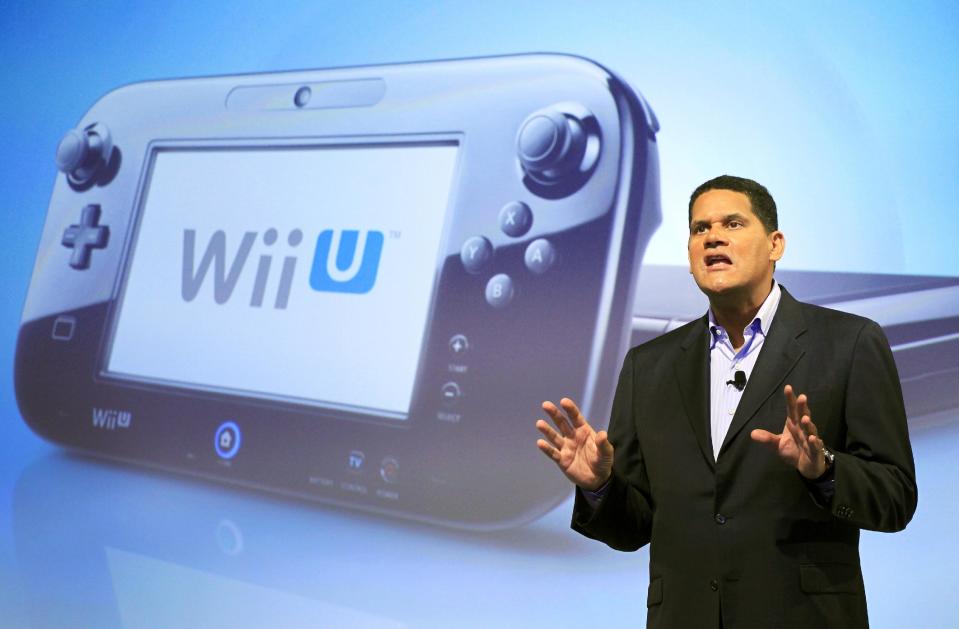 Reggie Fils-Aime, president and chief operating officer of Nintendo of America, discusses the upcoming Wii U gaming console, Thursday, Sept. 13, 2012 in New York. The gaming console will start at $300 and go on sale in the U.S. on Nov. 18, in time for the holidays, the company said Thursday. (AP Photo/Mark Lennihan)