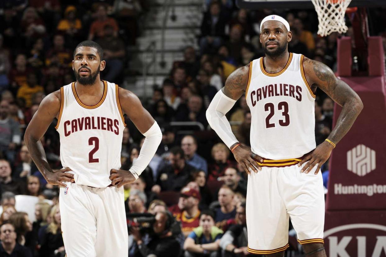 CLEVELAND, OH - DECEMBER 2: Kyrie Irving #2 and LeBron James #23 of the Cleveland Cavaliers during the game against the Milwaukee Bucks on December 2, 2014 at Quicken Loans Arena in Cleveland, Ohio. NOTE TO USER: User expressly acknowledges and agrees that, by downloading and/or using this Photograph, user is consenting to the terms and conditions of the Getty Images License Agreement. Mandatory Copyright Notice: Copyright 2014 NBAE (Photo by David Liam Kyle/NBAE via Getty Images)