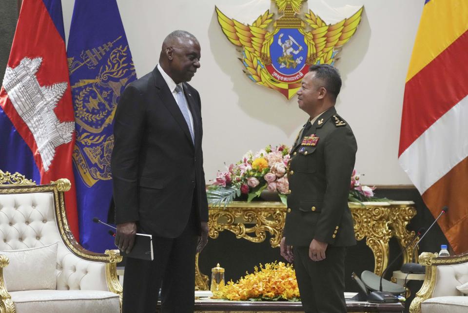 U.S. Defense Secretary Lloyd Austin, left, talks with Cambodian Defense Minister Tea Seiha at the Defense Ministry in Phnom Penh, Cambodia, Tuesday, June 4, 2024. Austin traveled to Cambodia on Tuesday to push for stronger military ties with China’s closest ally in Southeast Asia. (Heng Sinith/Pool Photo via AP)