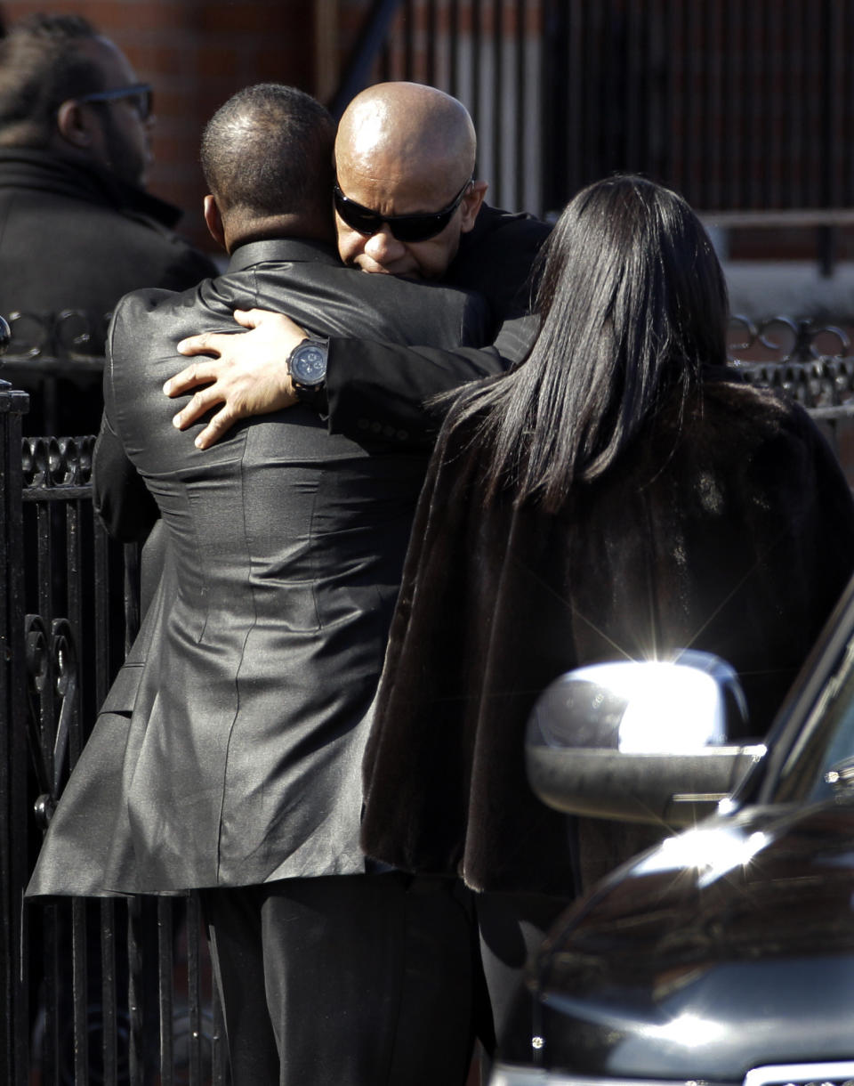 Bobby Brown, left, is greeted outside during the funeral of his ex-wife Whitney Houston at New Hope Baptist Church in Newark, N.J., Saturday, Feb. 18, 2012. Houston died last Saturday at the Beverly Hills Hilton in Beverly Hills, Calif., at the age 48. (AP Photo/Mel Evans)