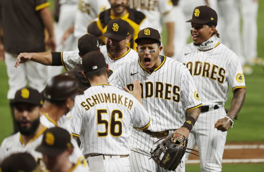 Manny Machado of the San Diego Padres celebrates after beating the St. Louis Cardinals 4-0 to win the Wild Card Series at Petco Park on Friday, Oct. 2, 2020. (K.C. Alfred / The San Diego Union-Tribune)