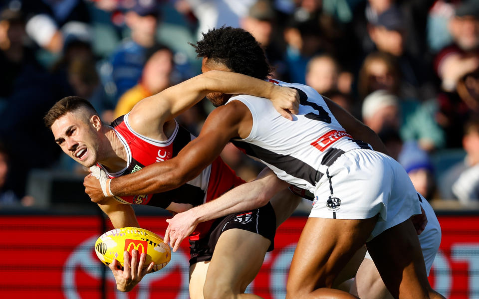 Jade Gresham being tackled in the AFL.